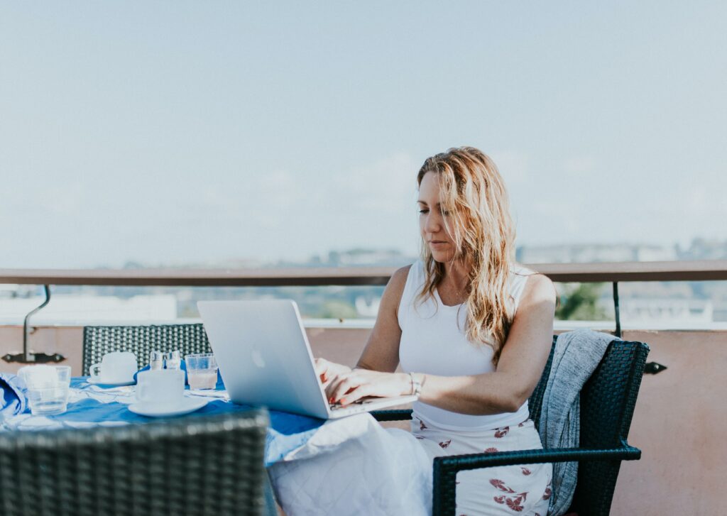 woman working on laptop outside